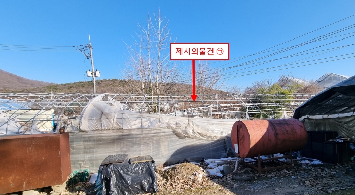 제시외 물건 ㉠